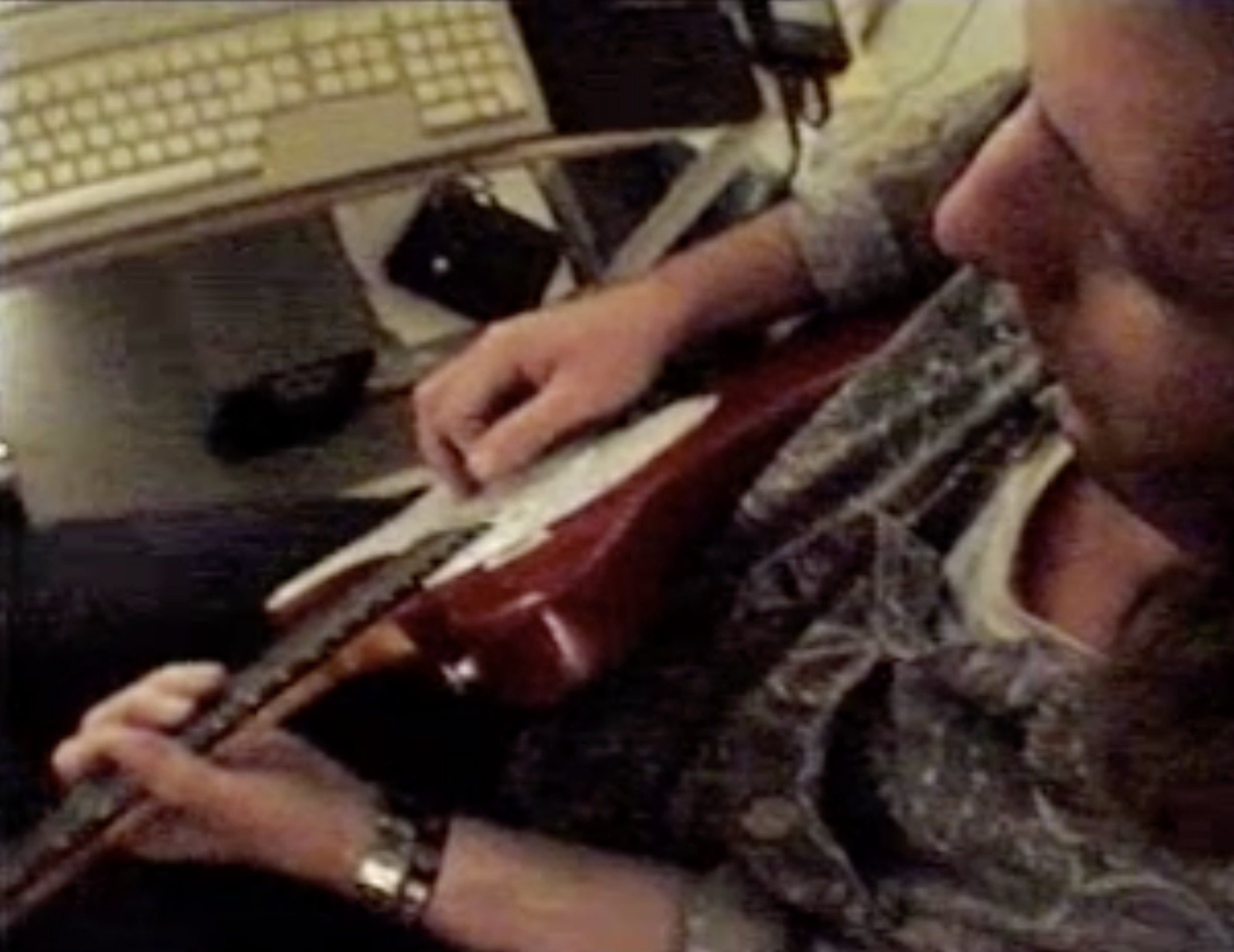 todd with red Telecaster guitar ans Atari computer